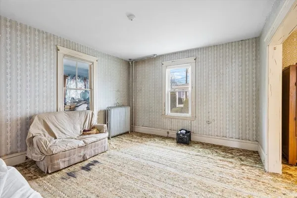 a living room with furniture and a window