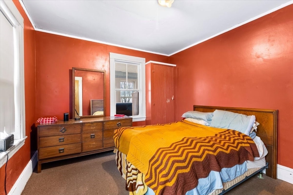 7 Liberty Street Mansfield, MA 02048 - Photo 4 of 42 a bedroom with a bed and a window