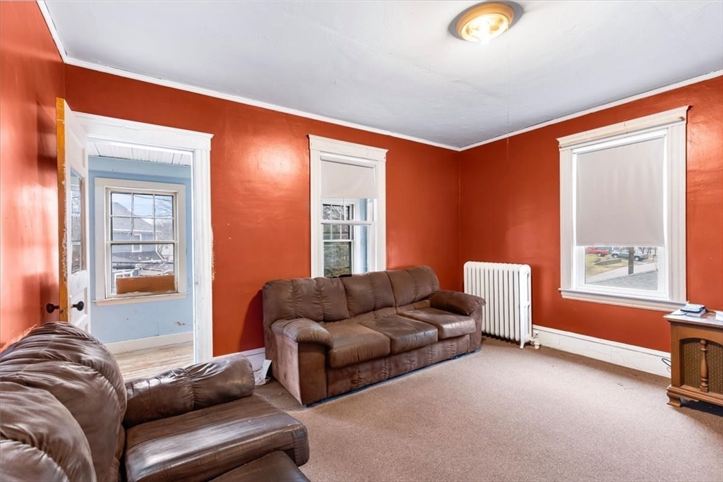 7 Liberty Street Mansfield, MA 02048 - Photo 5 of 42 a living room with furniture and a window