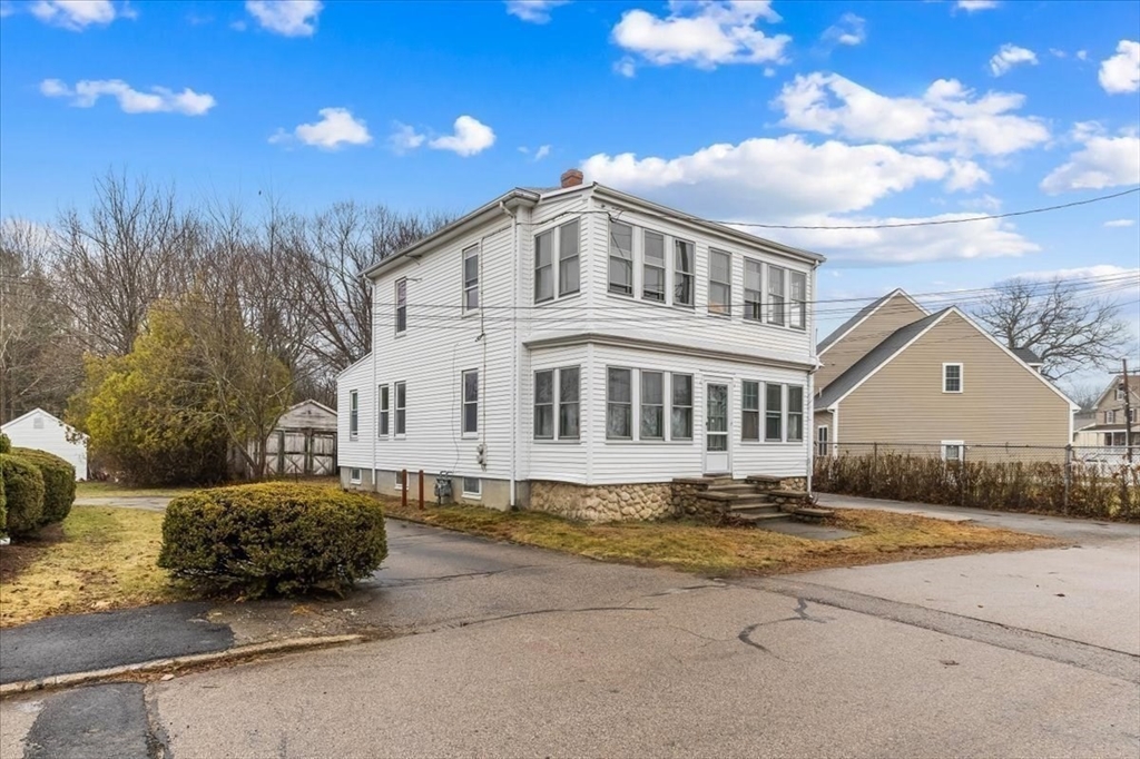 7 Liberty Street Mansfield, MA 02048 - Photo 6 of 42 a large white house with a large pool and yard