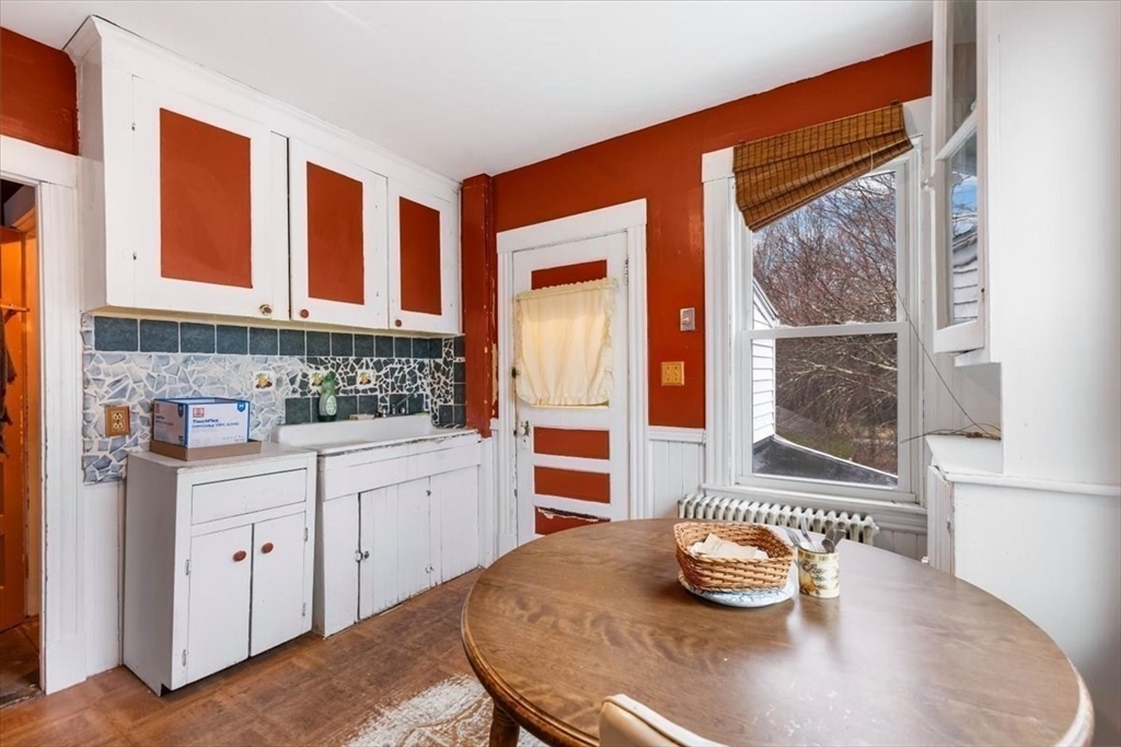 7 Liberty Street Mansfield, MA 02048 - Photo 9 of 42 a kitchen with stainless steel appliances a sink and cabinets