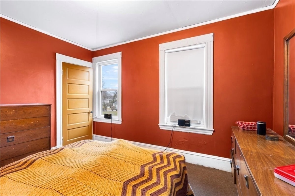 7 Liberty Street Mansfield, MA 02048 - Photo 10 of 42 a bedroom with a bed and wooden floor