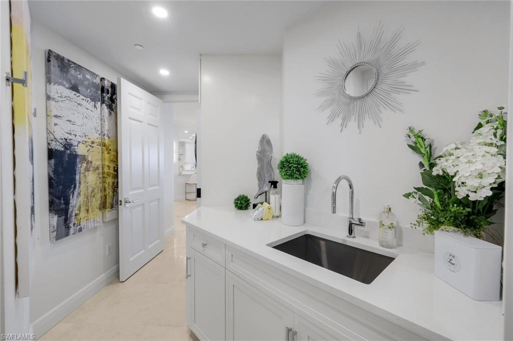 275 Indies Way, Unit 1503 Naples, FL 34110 - Photo 26 of 49 Laundry Room with Storage