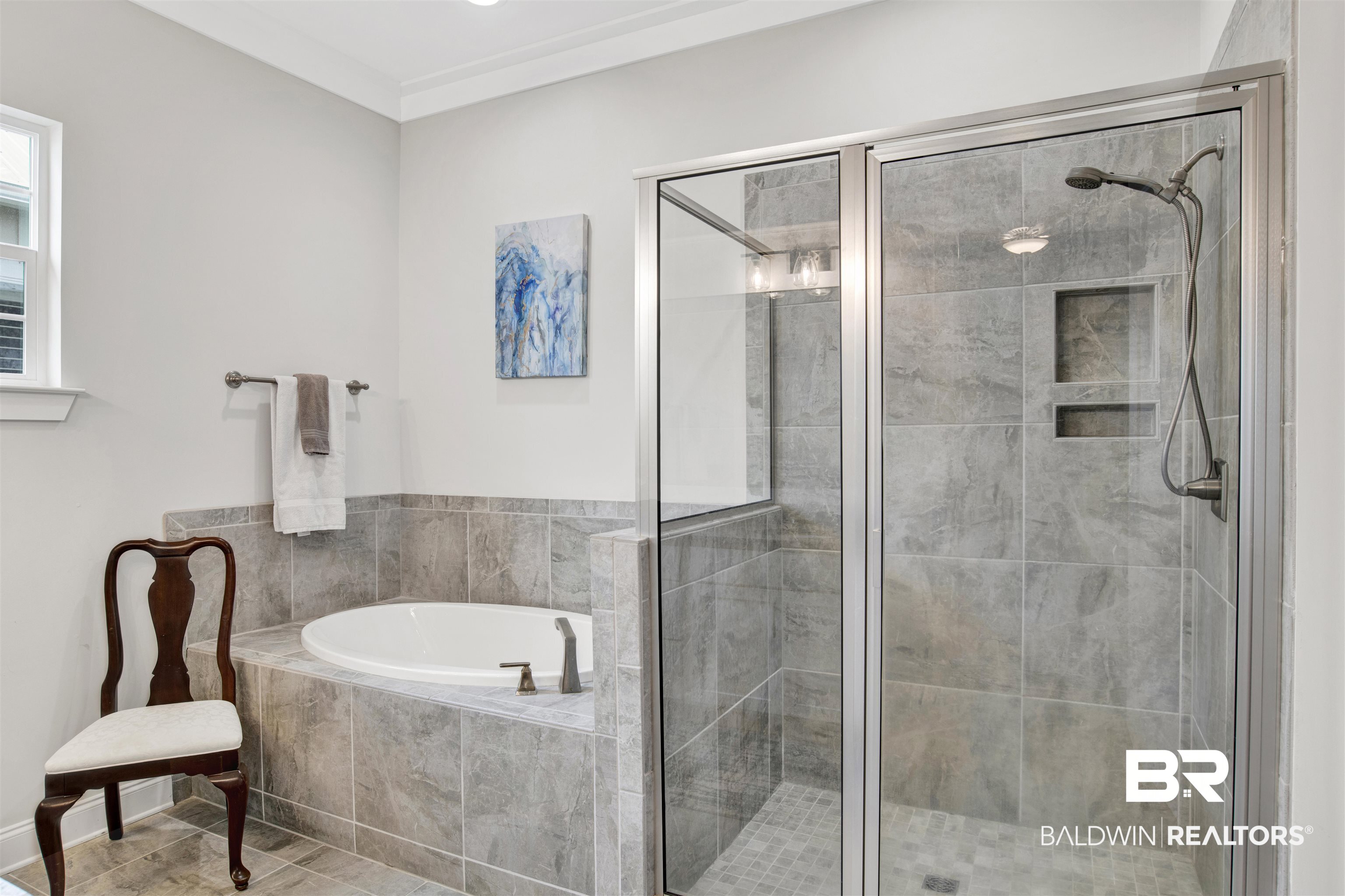 23893 Cypress Crossing Orange Beach, AL 36561 - Photo 10 of 22 Bathroom with a garden tub and a stall shower
