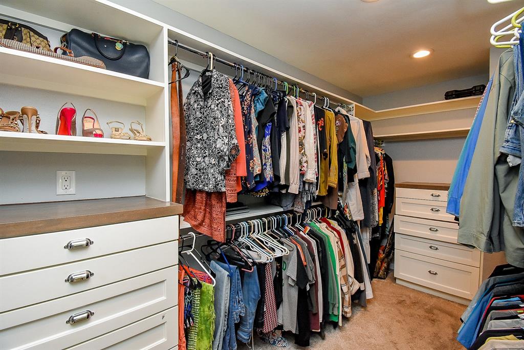 29400 Waller Gladish Road Waller, TX 77484 - Photo 20 of 39 a view of walk in closet with clothes and shoes