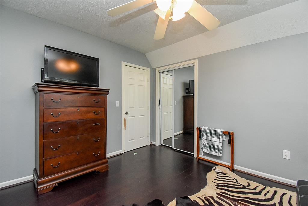 29400 Waller Gladish Road Waller, TX 77484 - Photo 22 of 39 a living room with furniture and a flat screen tv