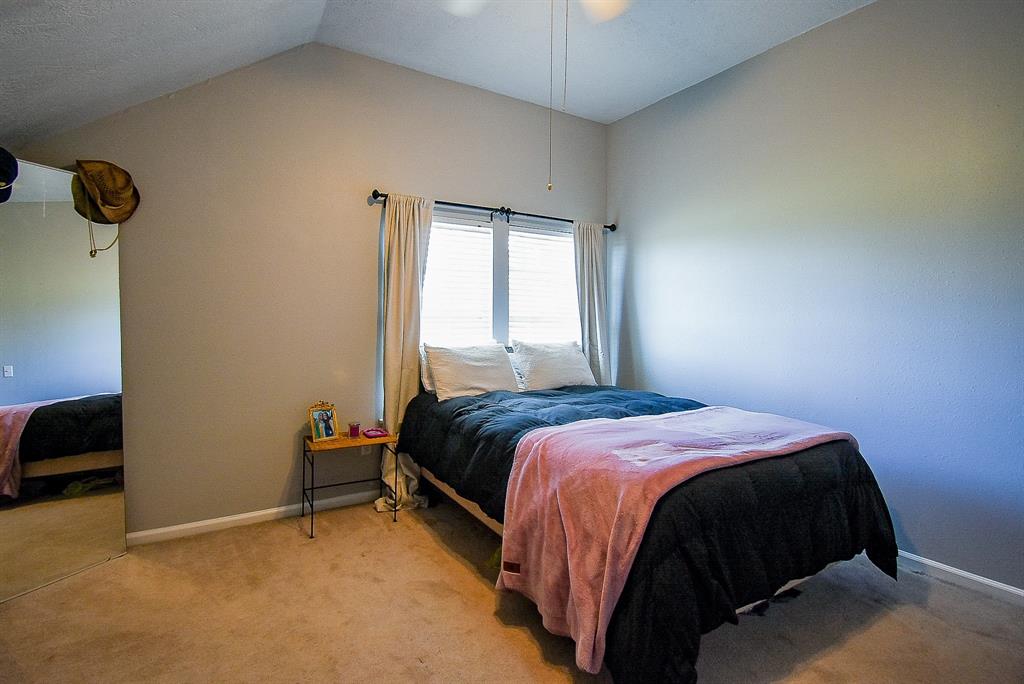 29400 Waller Gladish Road Waller, TX 77484 - Photo 27 of 39 a bedroom with a bed and a view of bedroom