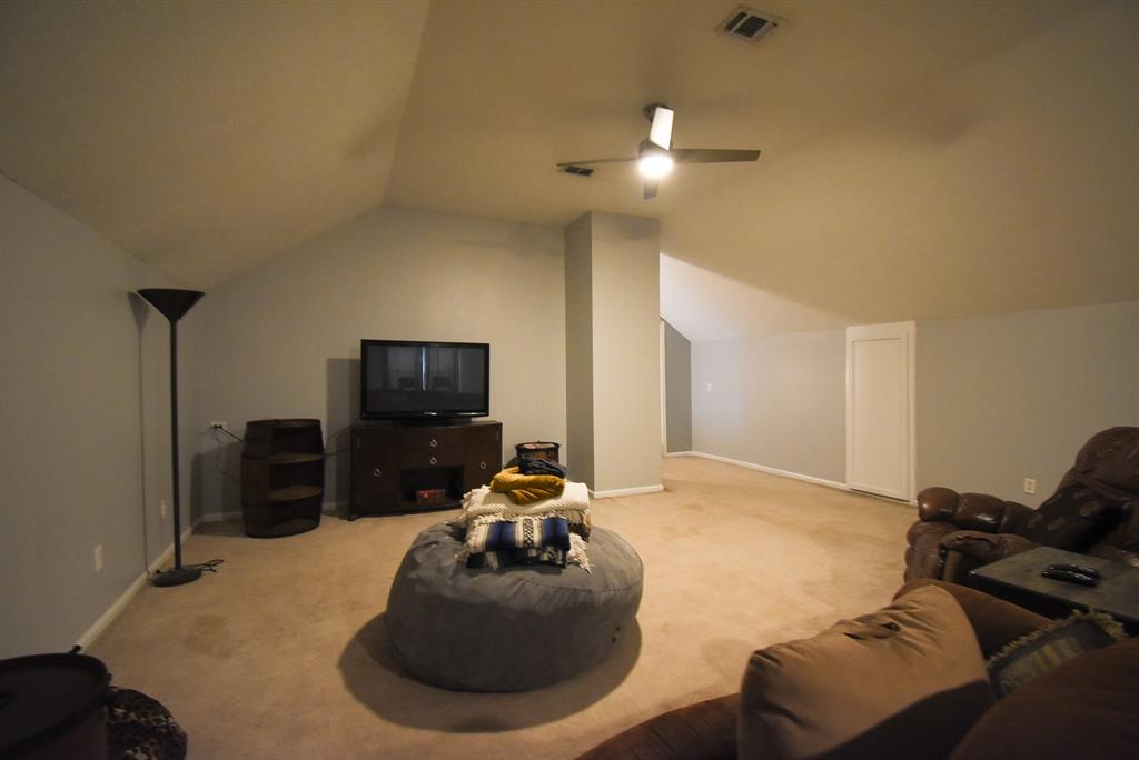 29400 Waller Gladish Road Waller, TX 77484 - Photo 31 of 39 a room with furniture and a flat screen tv