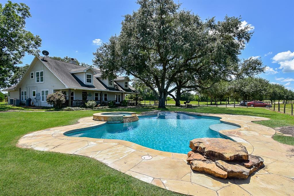 29400 Waller Gladish Road Waller, TX 77484 - Photo 33 of 39 a view of a house with swimming pool and yard