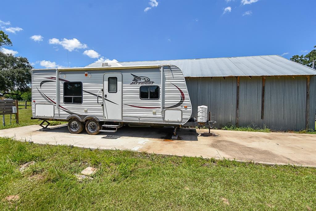 29400 Waller Gladish Road Waller, TX 77484 - Photo 38 of 39 a view of a house with backyard and sitting area