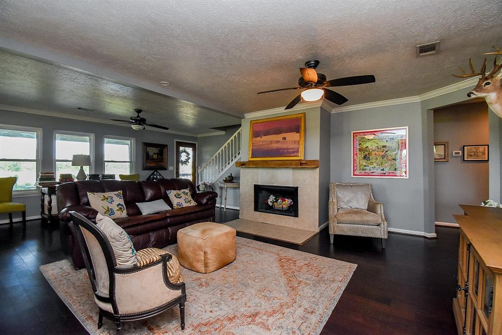 29400 Waller Gladish Road Waller, TX 77484 - Photo 6 of 39 a living room with furniture and a fireplace