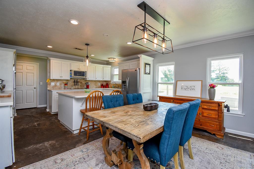 29400 Waller Gladish Road Waller, TX 77484 - Photo 8 of 39 a view of a dining room with furniture