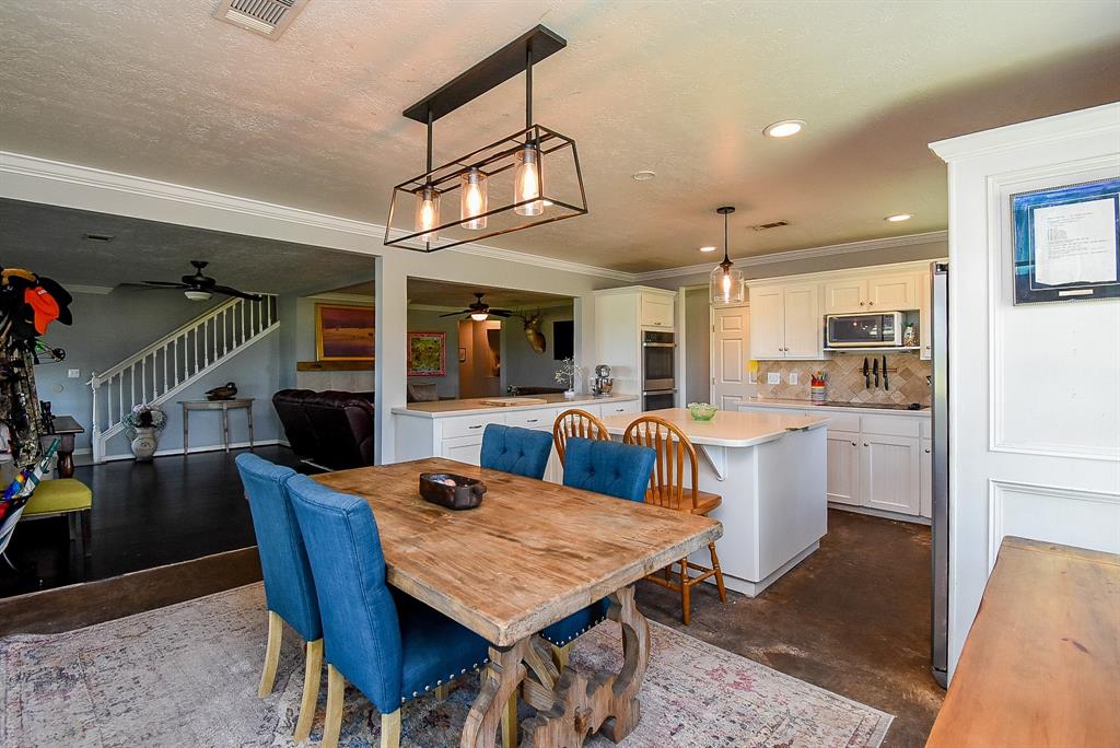 29400 Waller Gladish Road Waller, TX 77484 - Photo 9 of 39 a view of a dining room with furniture