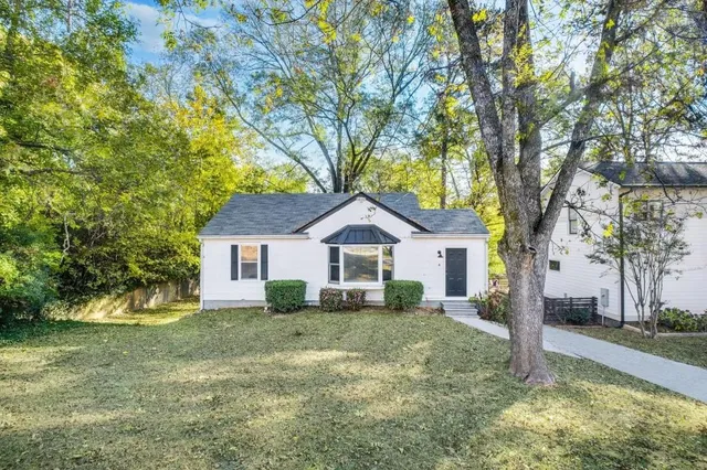 a house with trees in the background