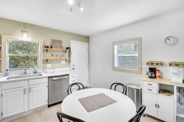 a kitchen with a sink stove and cabinets