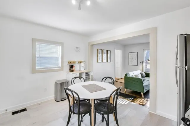 a view of a dining room with furniture and a livingroom
