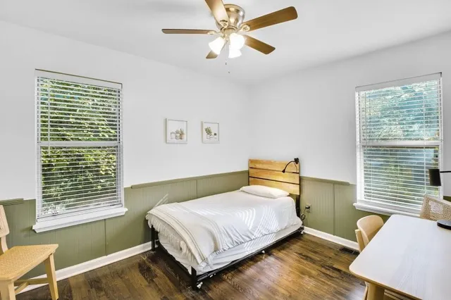 a bedroom with a bed and window