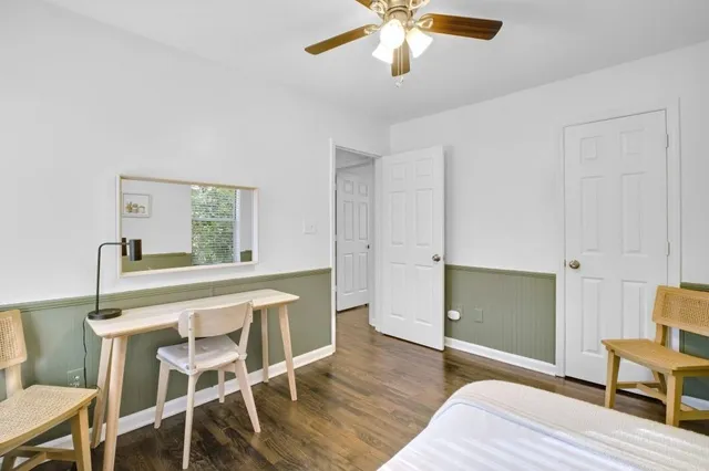 a view of a livingroom with furniture and wooden floor