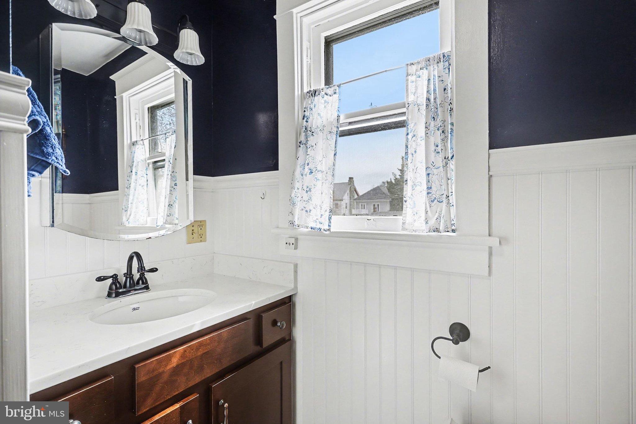 144 Seminary Avenue Gettysburg, PA 17325 - Photo 18 of 28 a bathroom with a sink vanity and mirror