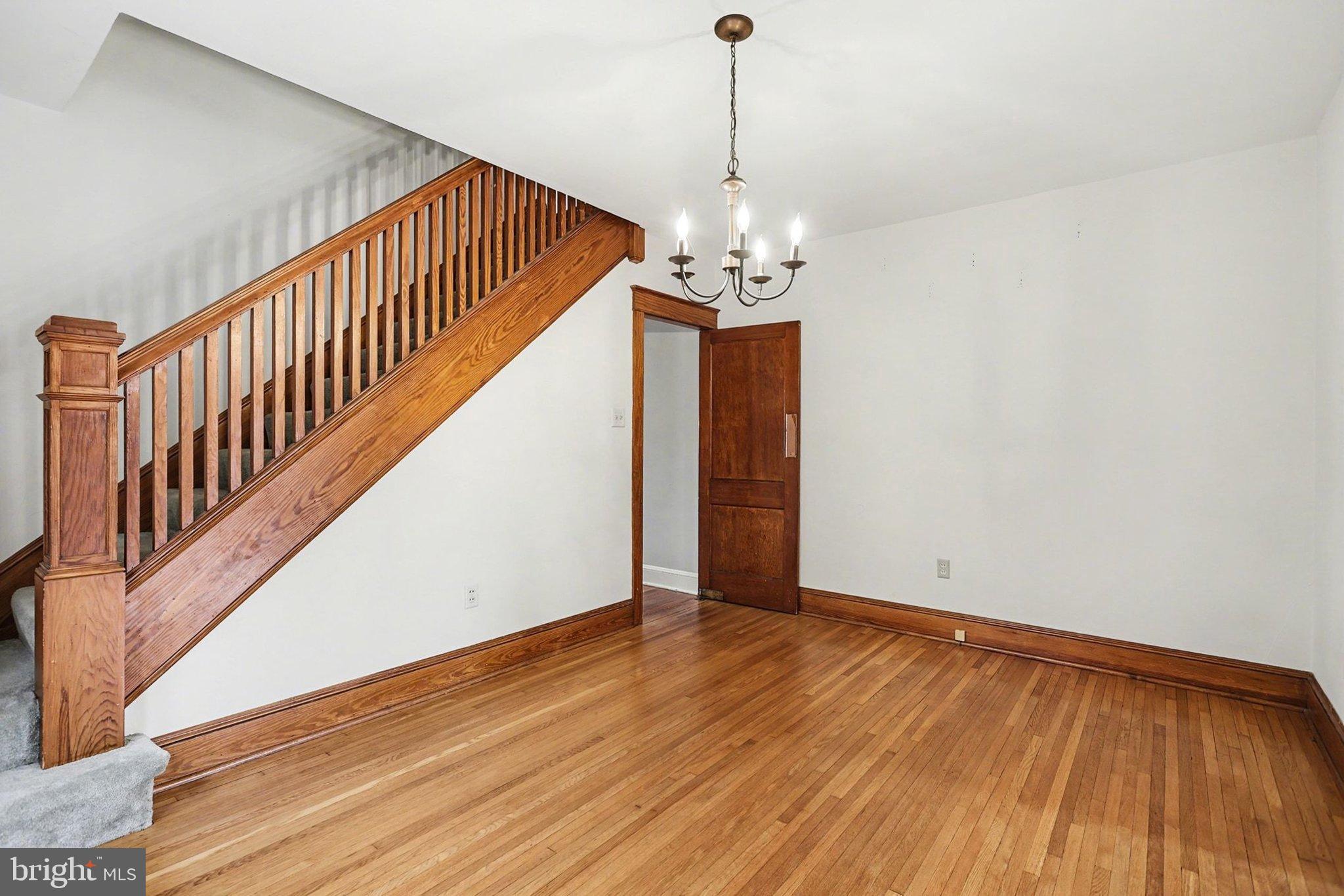 144 Seminary Avenue Gettysburg, PA 17325 - Photo 8 of 28 a view of a livingroom with wooden floor and staircase