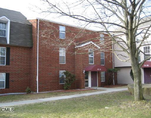 72 Heather Ridge, Unit 72 Shelton, CT 06484 - Photo 1 of 1 a front view of a house with a yard