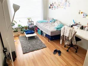 806 West 24th Street, Unit 229 Austin, TX 78705 - Photo 15 of 23 a living room with furniture and a wooden floor
