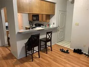 a room with furniture and wooden floor