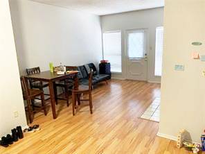 806 West 24th Street, Unit 229 Austin, TX 78705 - Photo 4 of 23 a view of a dining room with furniture and a window