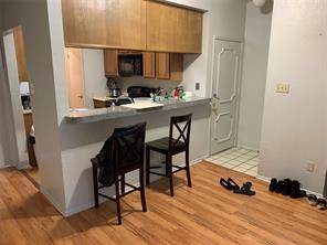 806 West 24th Street, Unit 229 Austin, TX 78705 - Photo 5 of 23 a room with furniture and wooden floor