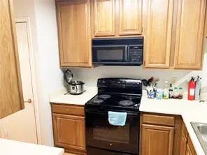a kitchen with a stove and a microwave