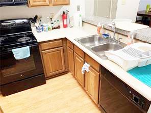 806 West 24th Street, Unit 229 Austin, TX 78705 - Photo 9 of 23 a kitchen with a sink stove and microwave