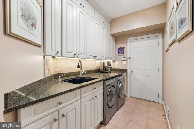 a spacious bathroom with a granite countertop tub shower sink and mirror