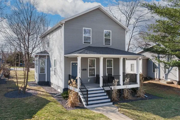a front view of a house with a porch