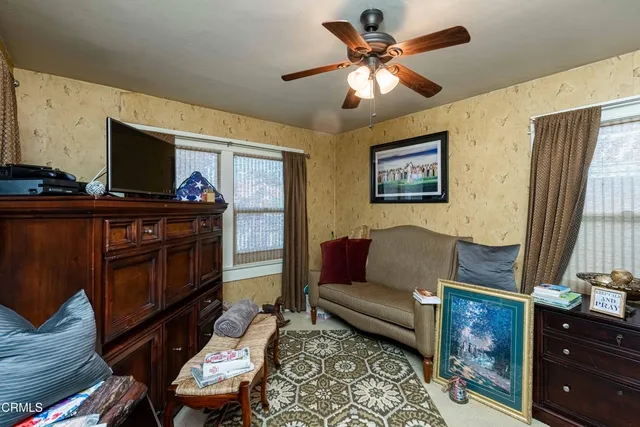 a bed room with a bed and a chandelier