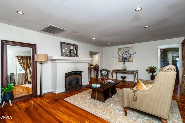 a kitchen with stainless steel appliances granite countertop a stove a refrigerator and a sink