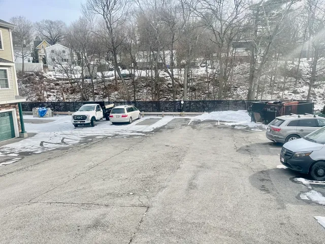 a view of parking with cars parked