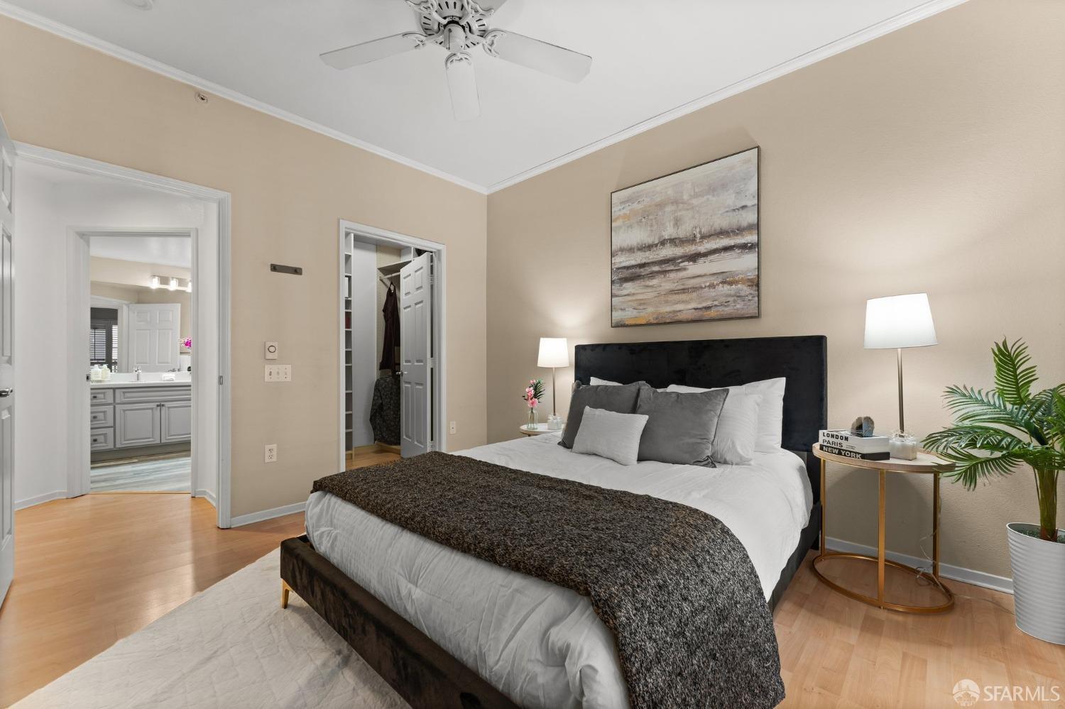 280 Caldecott Lane, Unit 101 Oakland, CA 94618 - Photo 21 of 32 a bedroom with bed and a chandelier