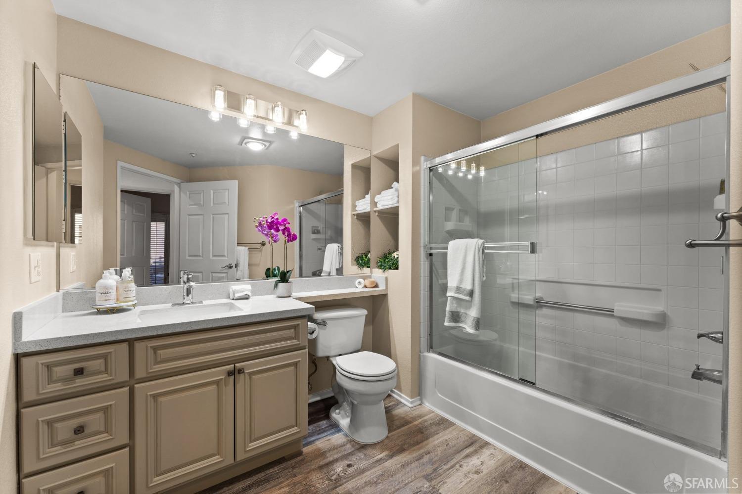 280 Caldecott Lane, Unit 101 Oakland, CA 94618 - Photo 24 of 32 a bathroom with a sink vanity mirror and toilet