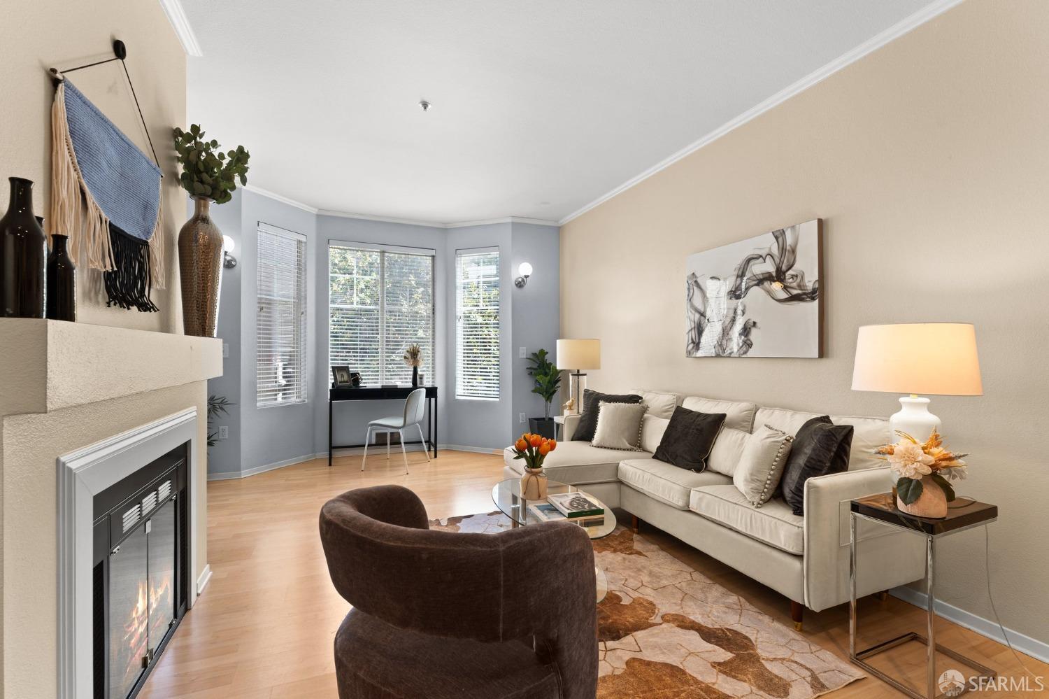 280 Caldecott Lane, Unit 101 Oakland, CA 94618 - Photo 25 of 32 a living room with furniture and a fireplace