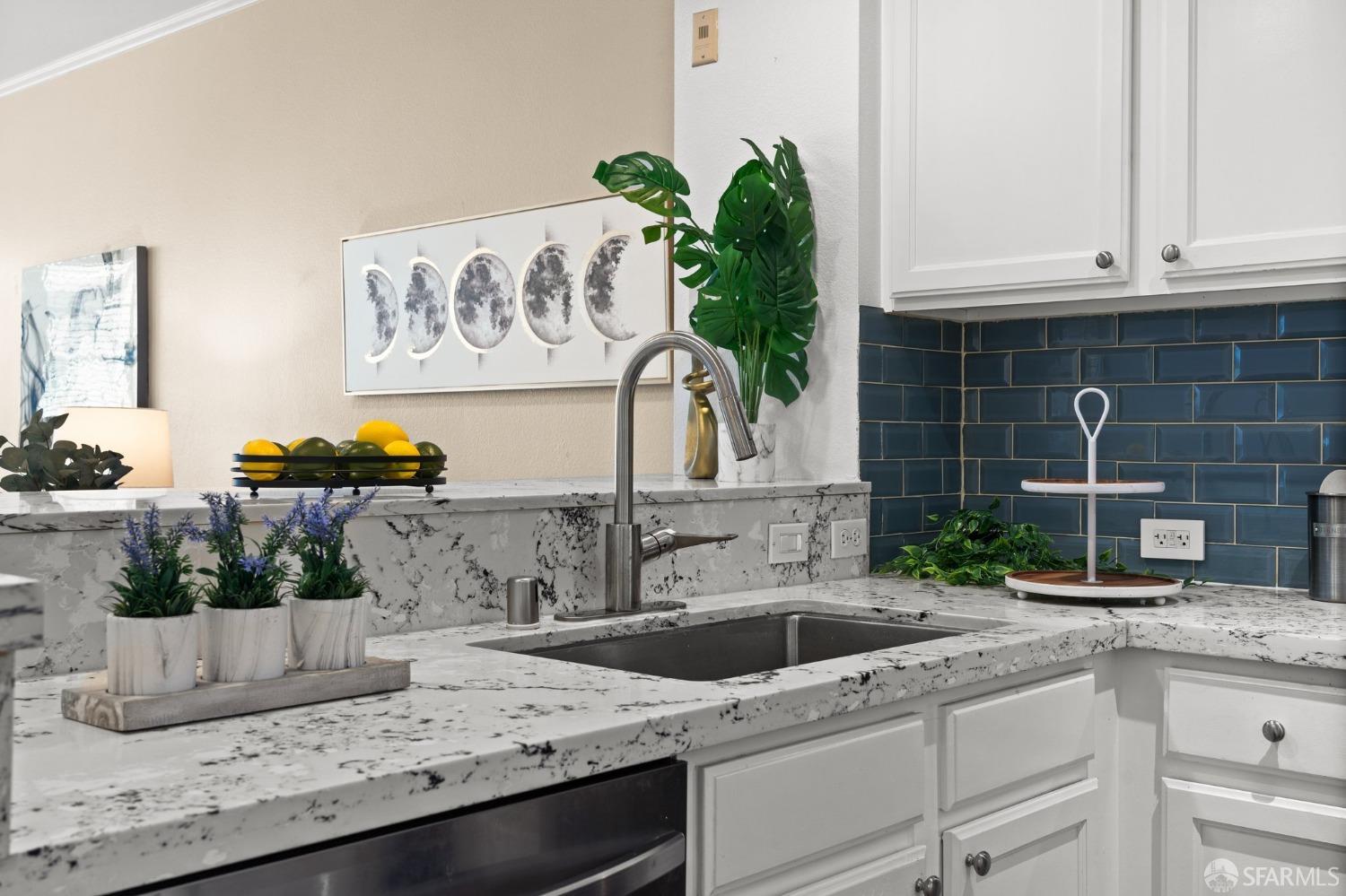 280 Caldecott Lane, Unit 101 Oakland, CA 94618 - Photo 8 of 32 a kitchen with stainless steel appliances granite countertop a sink a stove and a granite counter tops