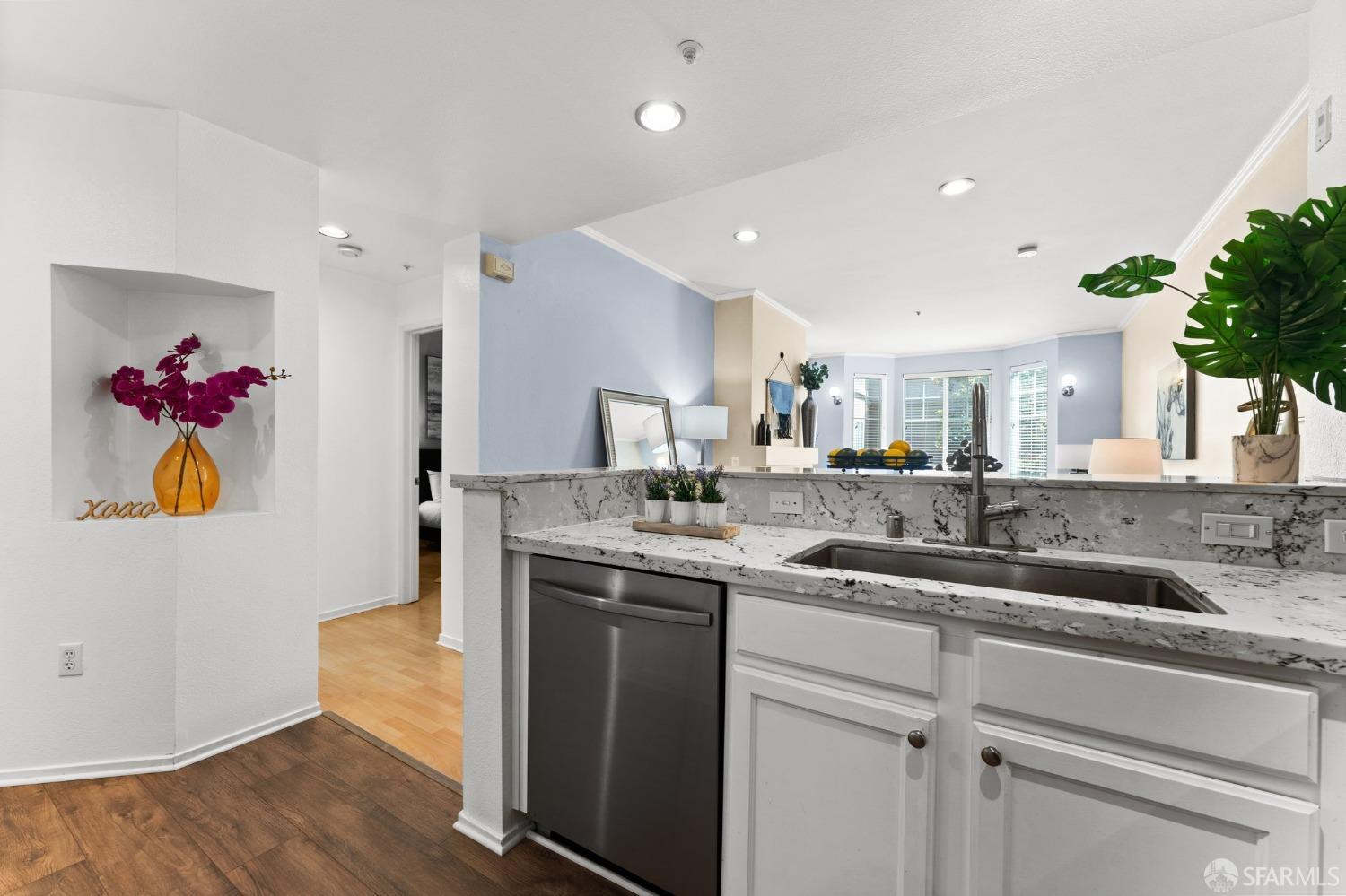 280 Caldecott Lane, Unit 101 Oakland, CA 94618 - Photo 9 of 32 a kitchen with a sink and a refrigerator