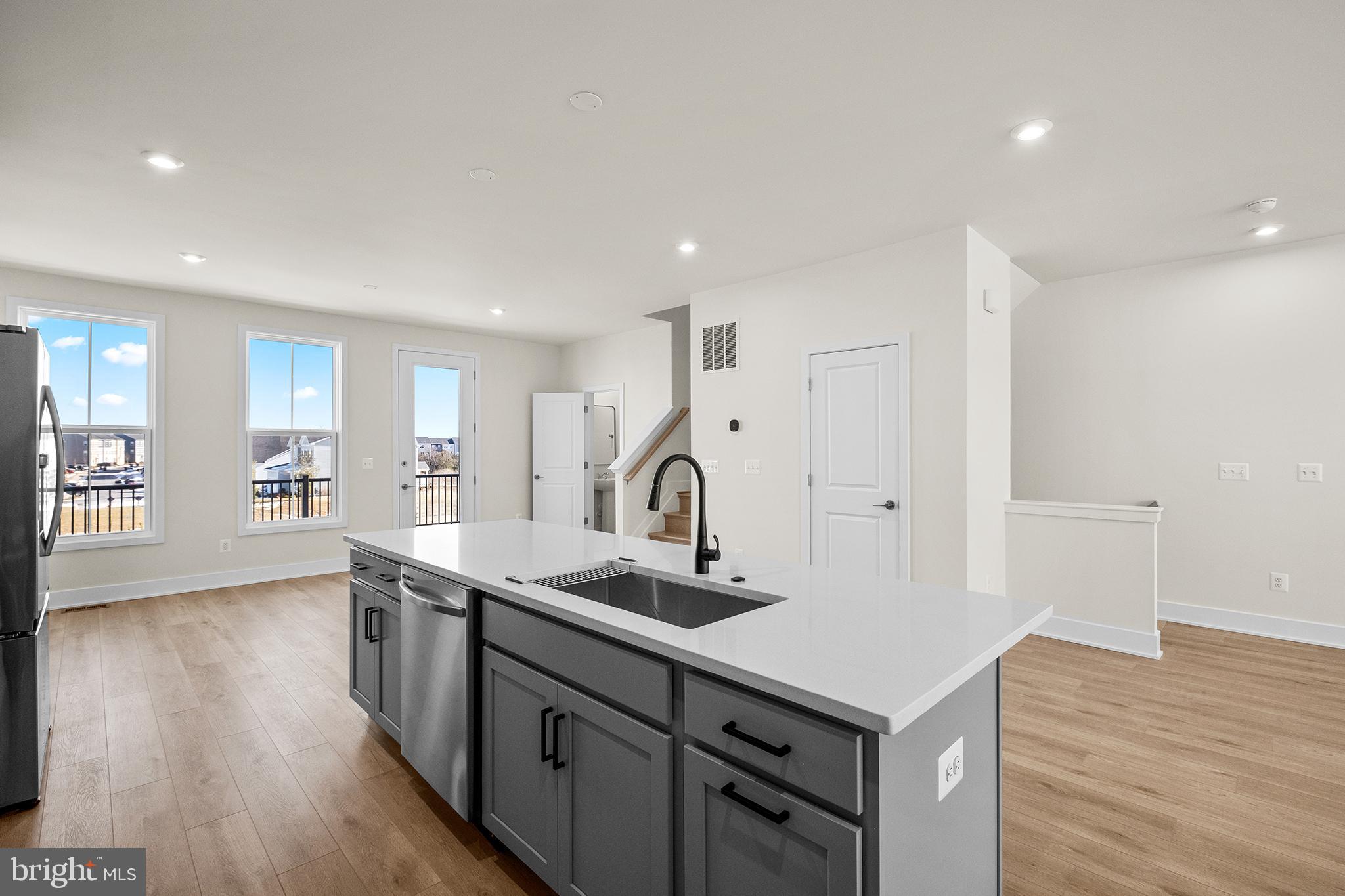 115 Galaxy Place Stephenson, VA 22656 - Photo 5 of 19 a kitchen with a sink cabinets and wooden floor