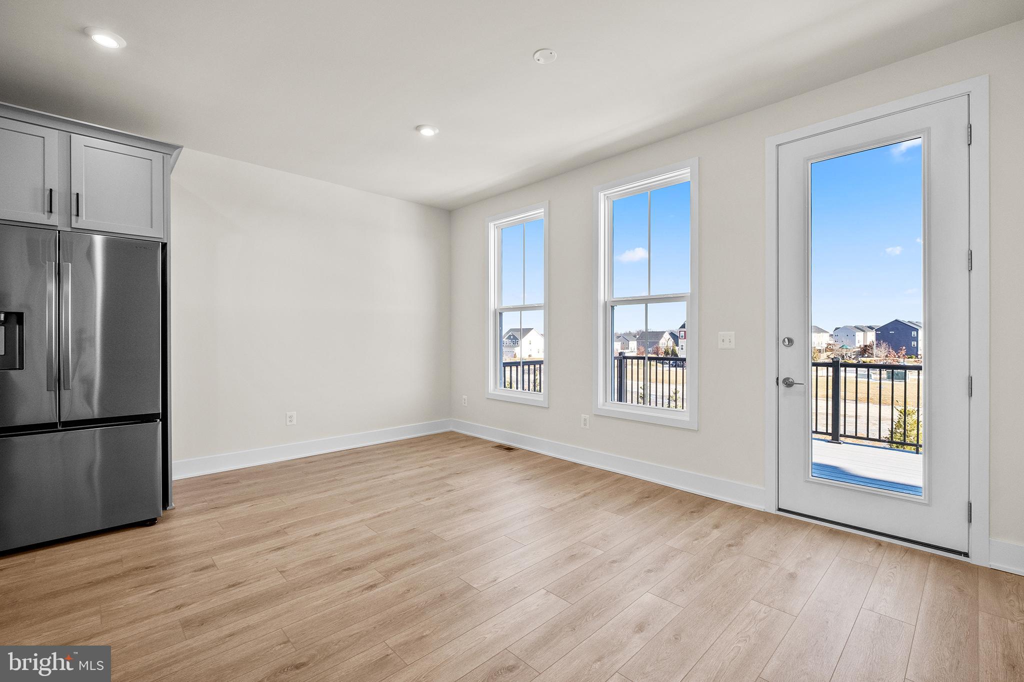 115 Galaxy Place Stephenson, VA 22656 - Photo 7 of 19 a view of an empty room with a window and wooden floor