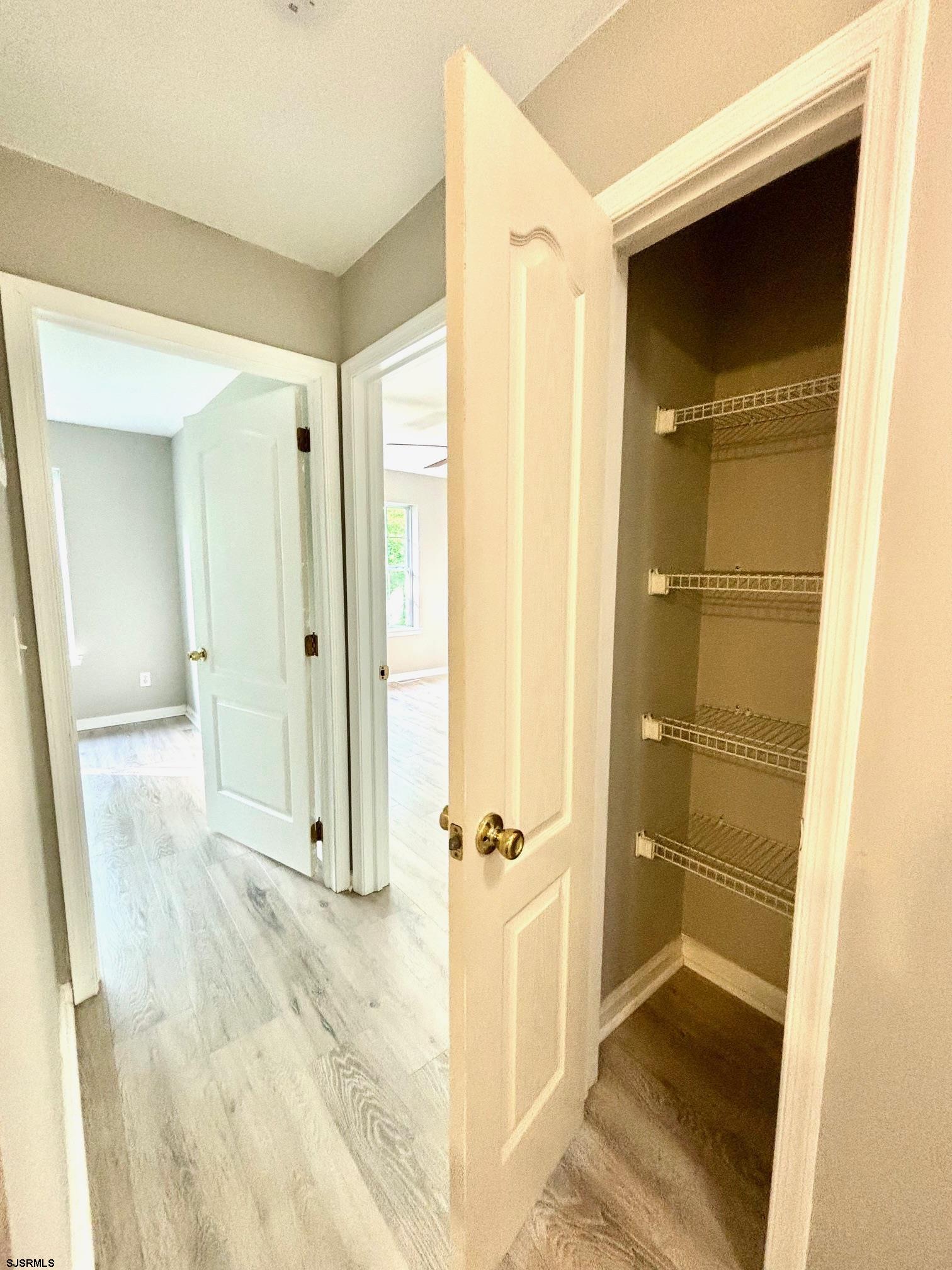 27 Oyster Bay, Unit G Absecon, NJ 08201 - Photo 18 of 31 a view of a bathroom with a glass door