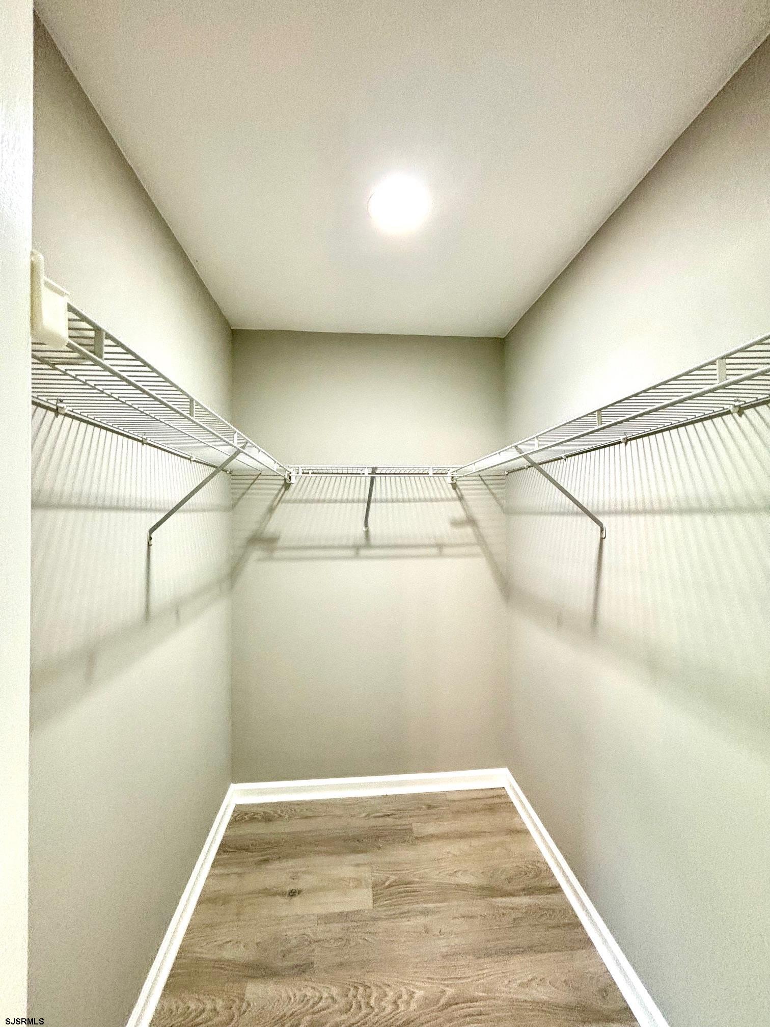 27 Oyster Bay, Unit G Absecon, NJ 08201 - Photo 23 of 31 a view of a room with racks on the wall