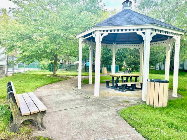 a view of yard with green space and porch
