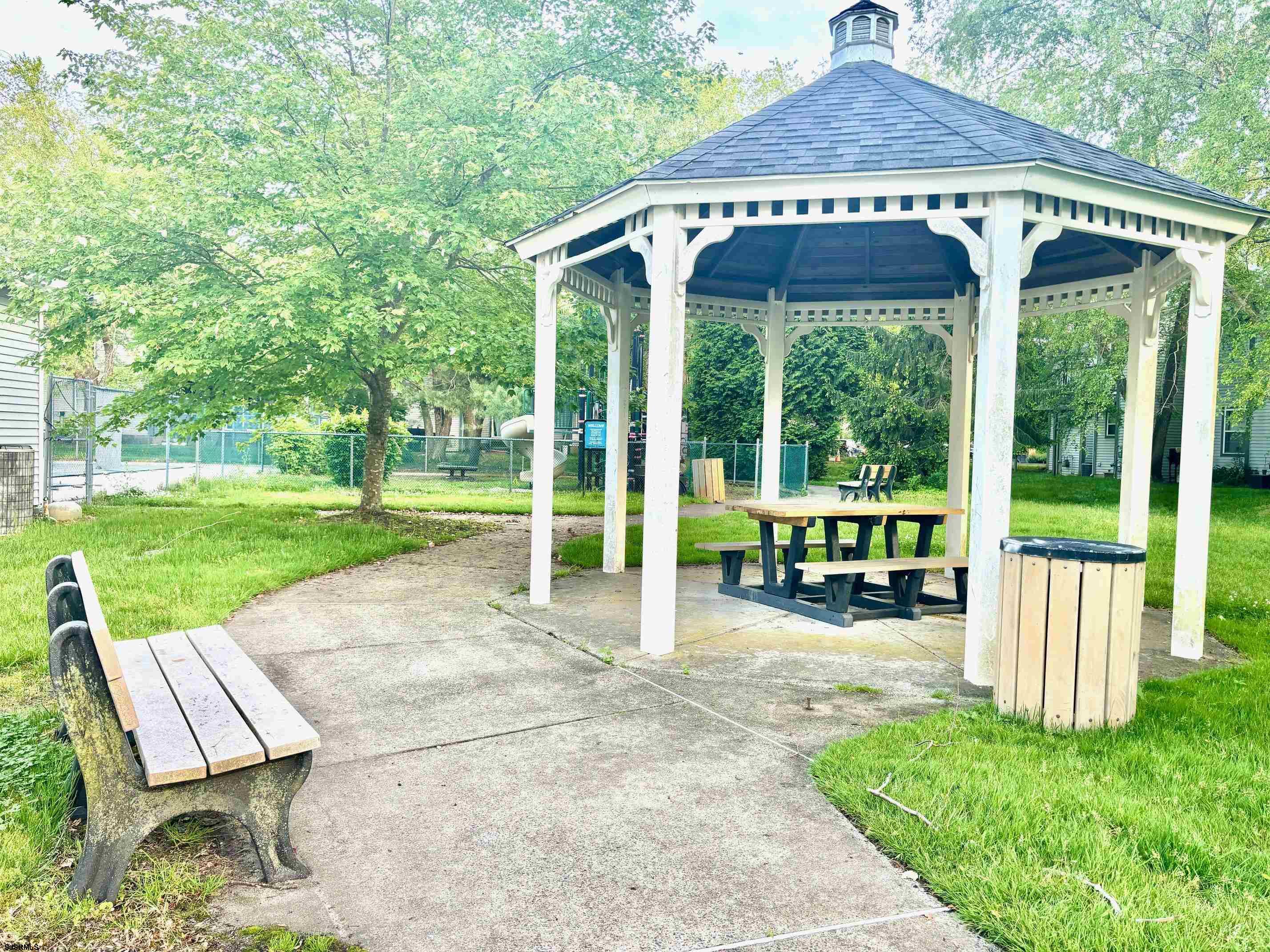 27 Oyster Bay, Unit G Absecon, NJ 08201 - Photo 30 of 31 a view of yard with green space and porch