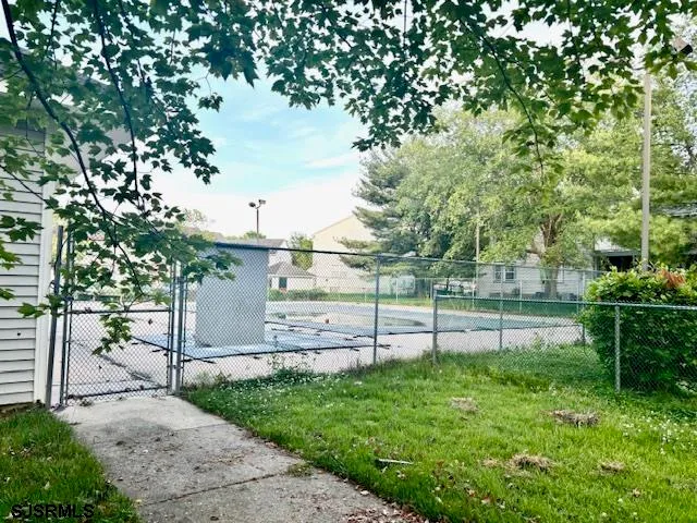 a view of a yard with a tree