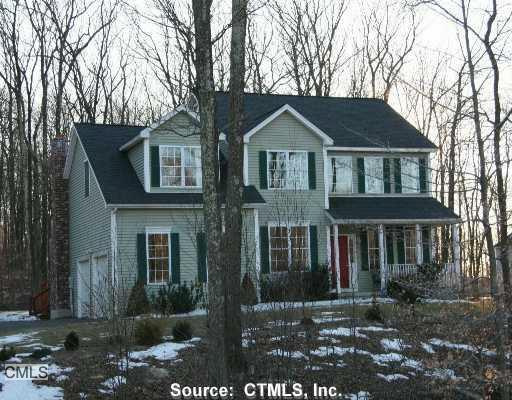 a front view of a house with yard