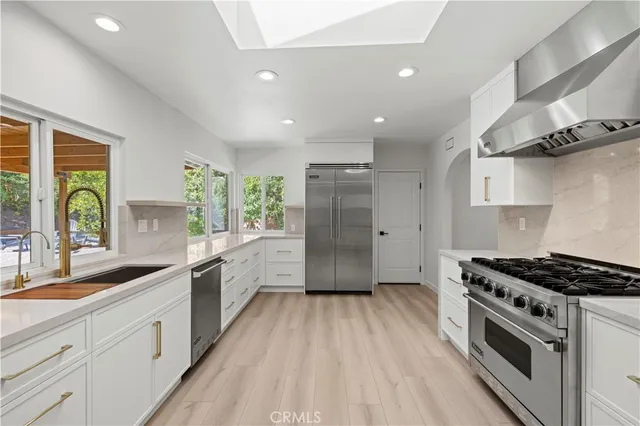 a view of kitchen with wooden floor and sink